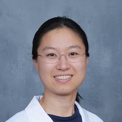 Chronic Pain Suwanee GA Danqing Hu About Interventional Pain Physician Danqing Hu Smiling In Lab Coat